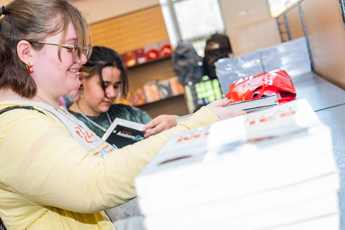 students buying textbooks